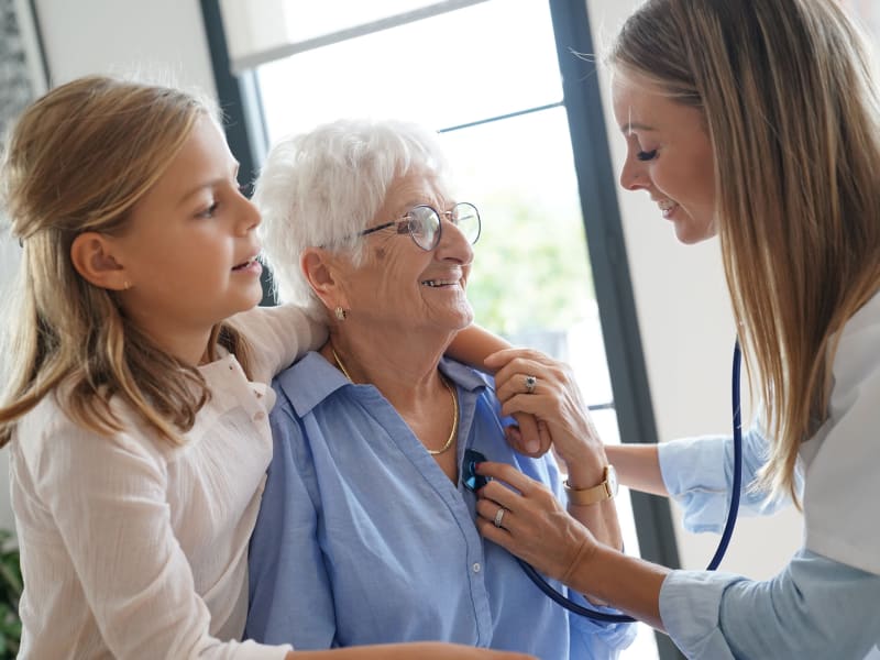 health professional taking to a resident at Villas At Maple Ridge in Spooner, Wisconsin