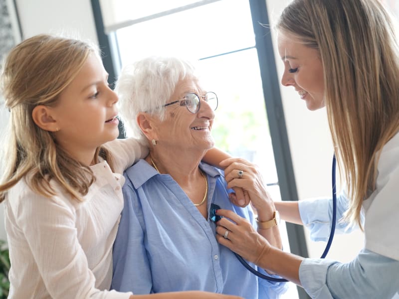 health professional taking to a resident at The Residences on Forest Lane in Montello, Wisconsin