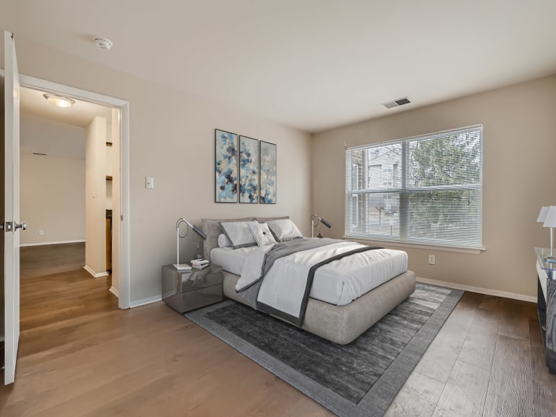 Well-furnished main bedroom in a model apartment at Hunt Club in Gaithersburg, Maryland