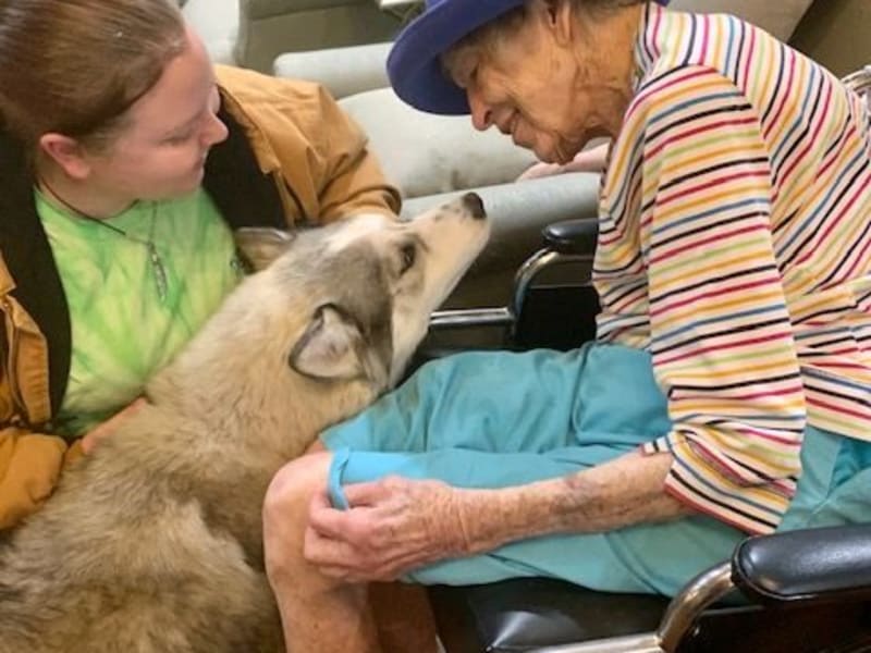 Resident with puppy at Shawnee Memory Care in Shawnee, Oklahoma
