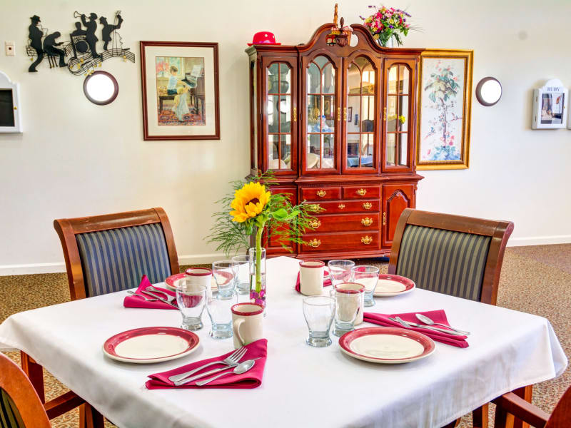 Dining table with a fresh flower at Callahan Court Memory Care in Roseburg, Oregon