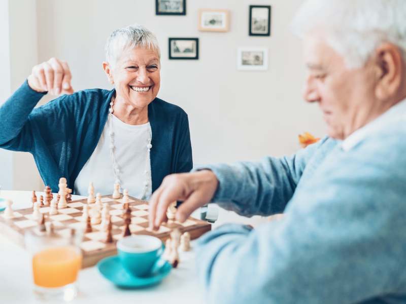 Residents playing chess together at Pine Rock Manor in Warner, New Hampshire