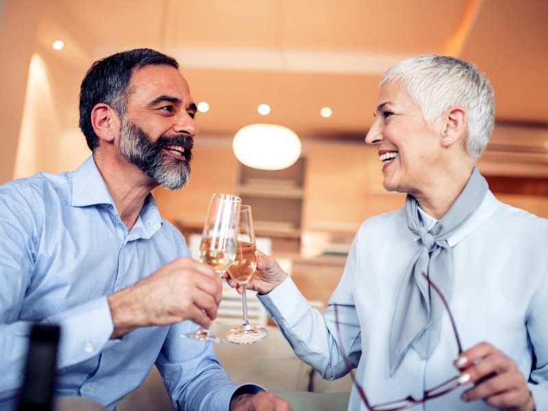Residents toasting glasses at their favorite restaurant near One West Hartford in West Hartford, Connecticut