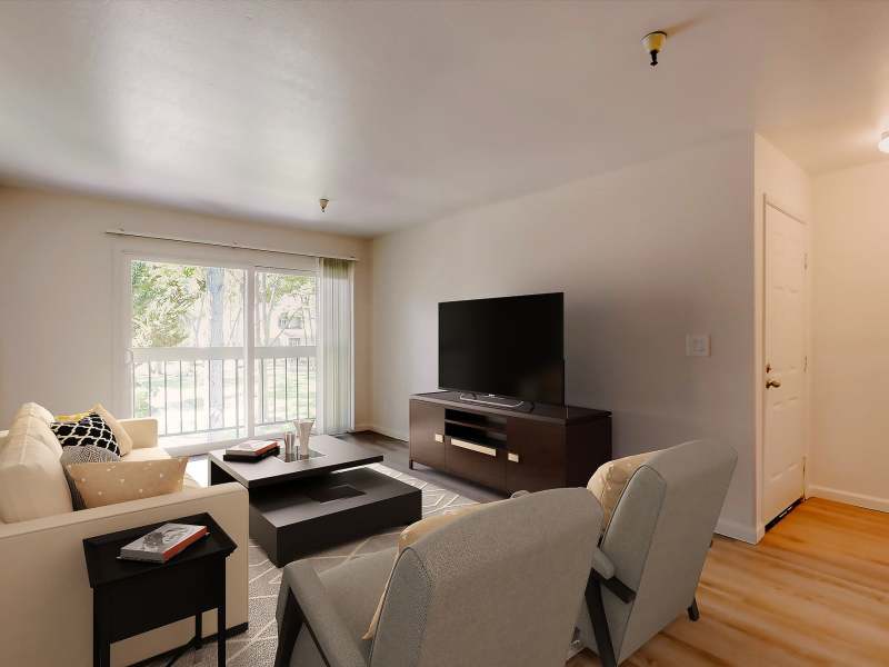 Spacious living room with a couch at Terman Apartments in Palo Alto, California