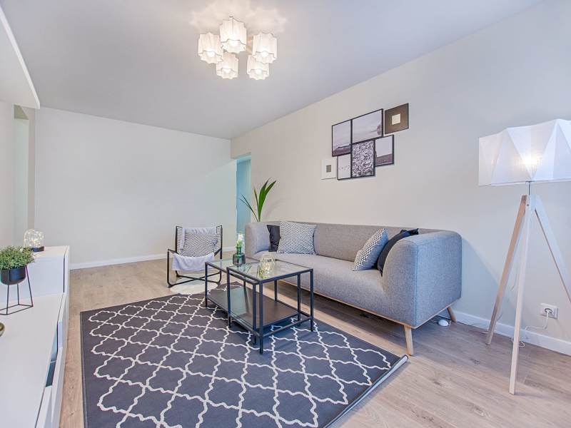 Living room with grey sofa at Fairway in South San Francisco, California