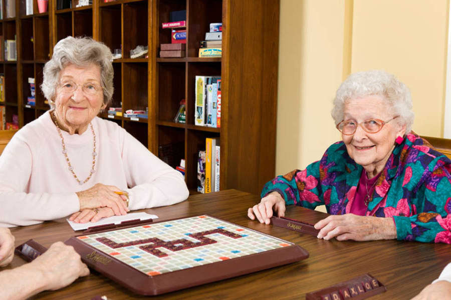Residents playing scrabble at The Manor at Market Square in Reading, Pennsylvania