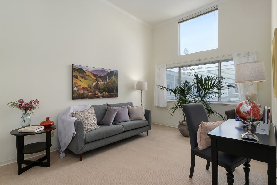 Spacious living room in one of our resident suites at Palo Alto Commons in Palo Alto, California