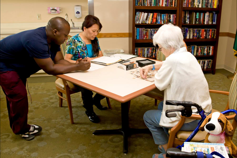 Residents in the game room at a Careage community. 