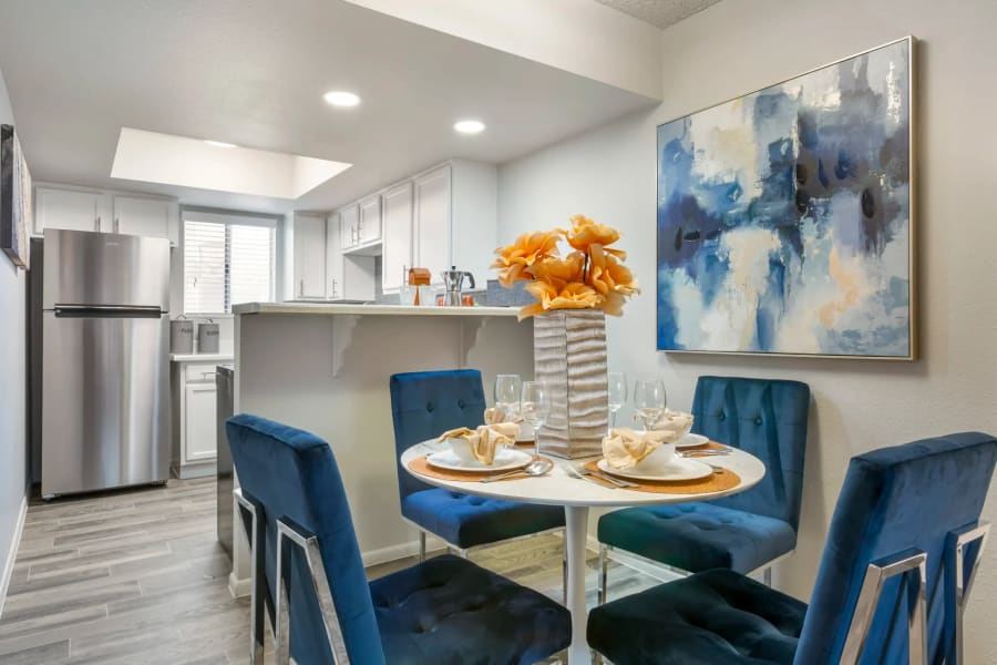 Model dining area and kitchen in a unit at Newport in Avondale, Arizona