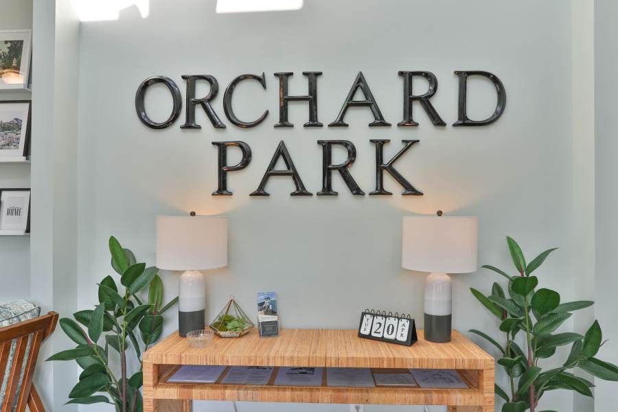 signage in the community center at Acasă Orchard Park Apartments in Greenville, South Carolina