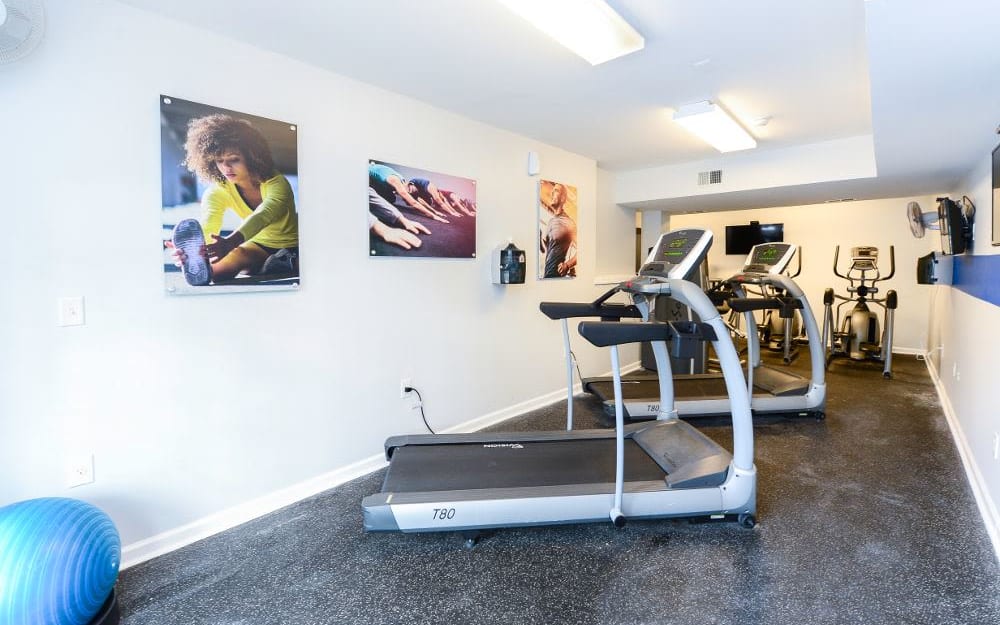 Well-equipped fitness center with cardio equipment at Mews at Annandale Townhomes in Annandale, New Jersey