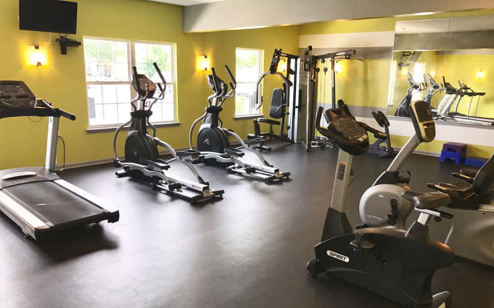 Well-equipped fitness center with cardio equipment at Woodview at Marlton Apartment Homes in Marlton, New Jersey