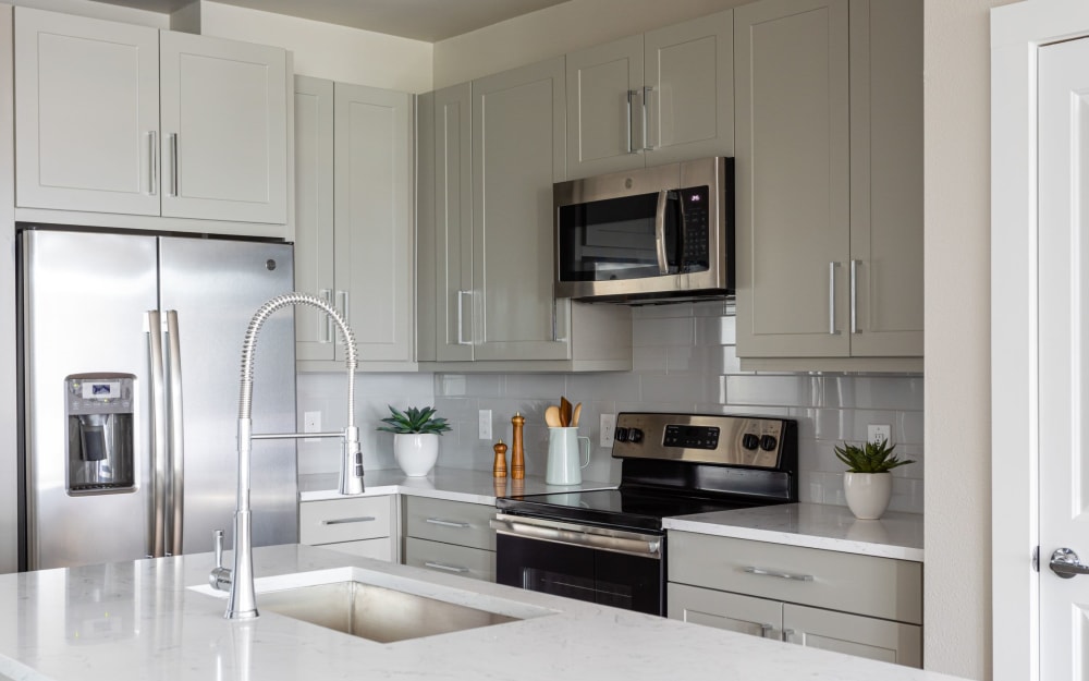 White carrera-style quartz countertops at Opal at Barker Cypress in Houston, Texas
