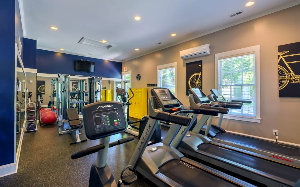 Well-equipped fitness center with cardio equipment at Christopher Wren Apartments & Townhomes in Wexford, Pennsylvania