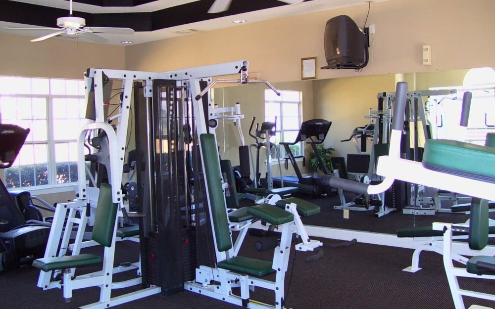 Well-equipped fitness center with cardio equipment at Manchester at Wesleyan Apartment Homes in Macon, Georgia