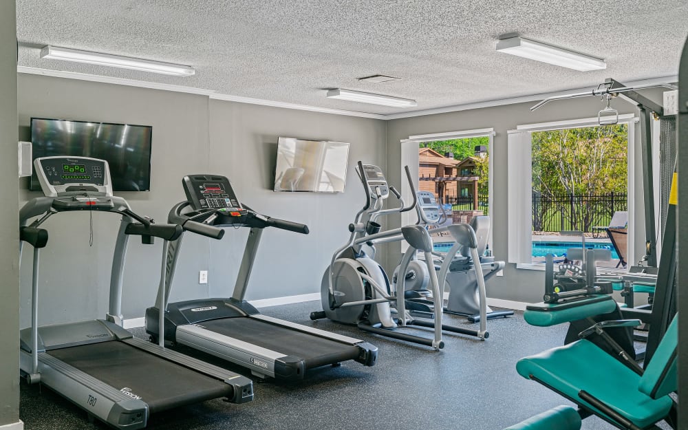Well-equipped fitness center with cardio equipment at Riverwind Apartment Homes in Spartanburg, South Carolina