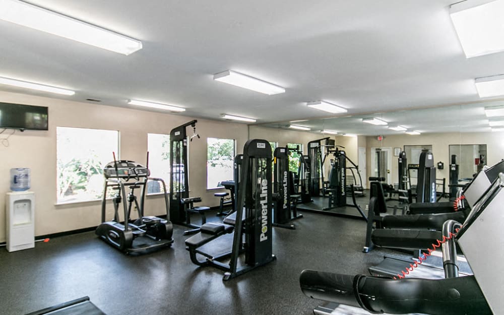Well-equipped fitness center with cardio equipment at The Waterford Apartments in Columbia, South Carolina