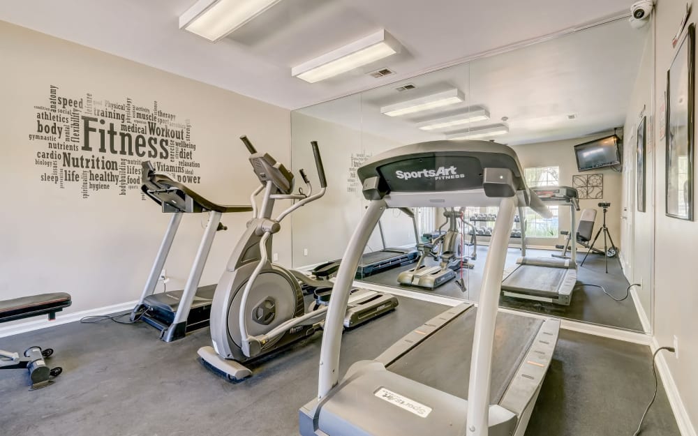 Well-equipped fitness center with cardio equipment at Rivoli Run Apartment Homes in Macon, Georgia