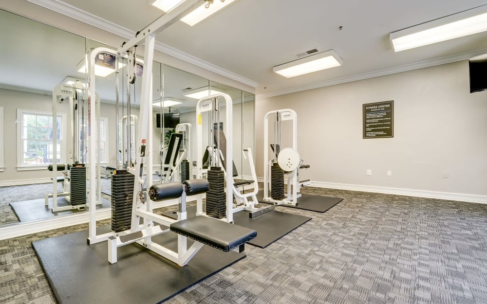 Well-equipped fitness center with cardio equipment at Keswick Village Apartments & Townhomes in Conyers, Georgia