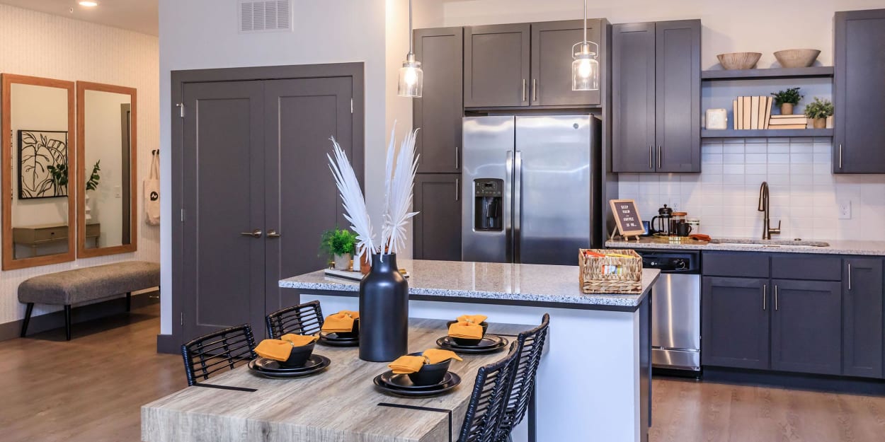 Kitchen with an island and stainless-steel appliances at Mandolin at Stream Valley in Franklin, Tennessee