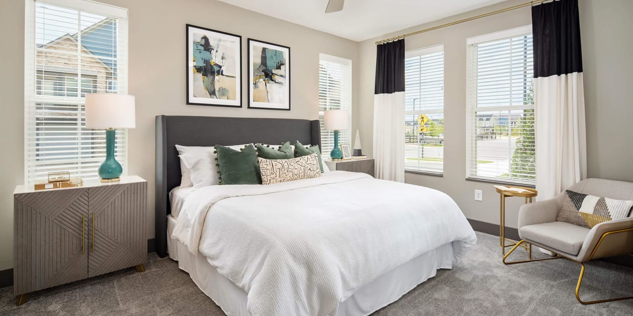 Spacious bedroom with bright windows at Mandolin at Stream Valley in Franklin, Tennessee