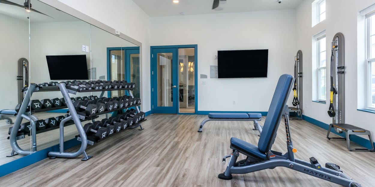 Free weights in the fitness center at Mandolin at Stream Valley in Franklin, Tennessee