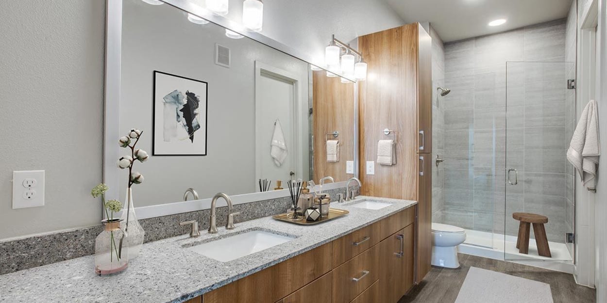 Spacious bathroom with a walk-in shower at The Cooper in Fort Worth, Texas