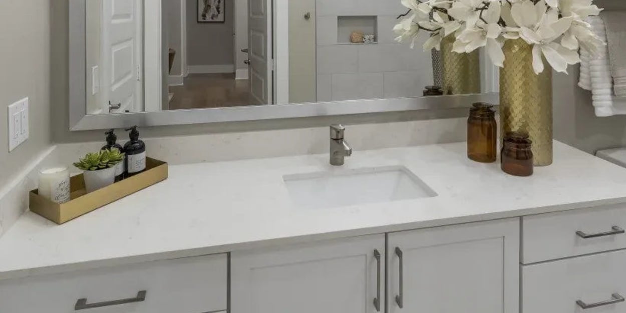 Modern finishes in an apartment bathroom at The Register in Richardson, Texas