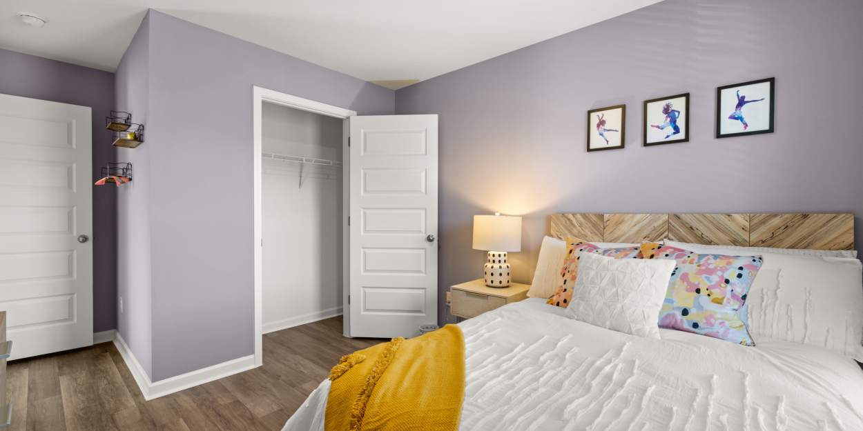 Bedroom with walk-in closet at The Lakes at Statham in Statham, Georgia