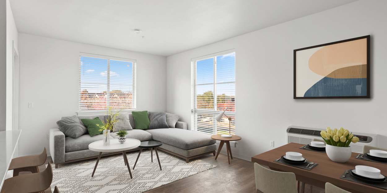 A living room with hardwood floors at The Meadowlark at Fairview in Fairview, Oregon