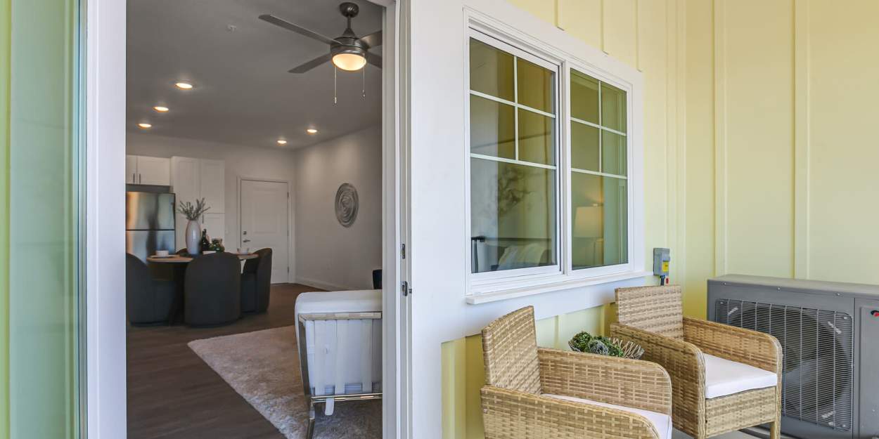 Patio furniture on a private balcony at Grand Oak Apartments in Largo, Florida