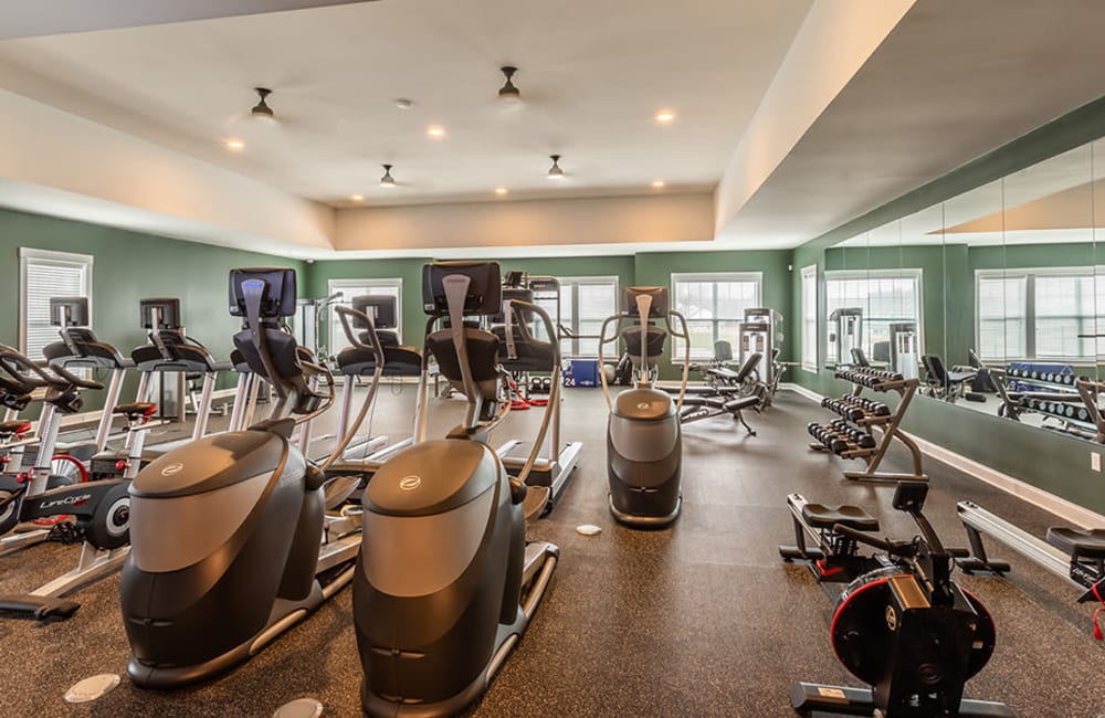 Fitness center at Woodland Acres Townhomes in Liverpool, New York