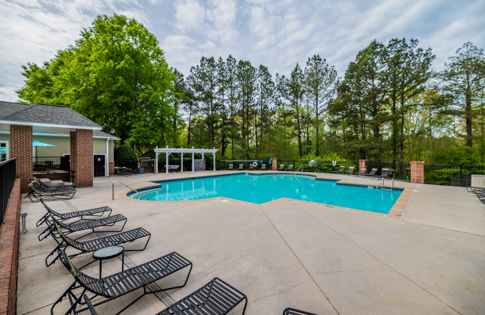 Beautiful blue sky with a luxurious pool Keswick Village Apartments & Townhomes in Conyers, Georgia