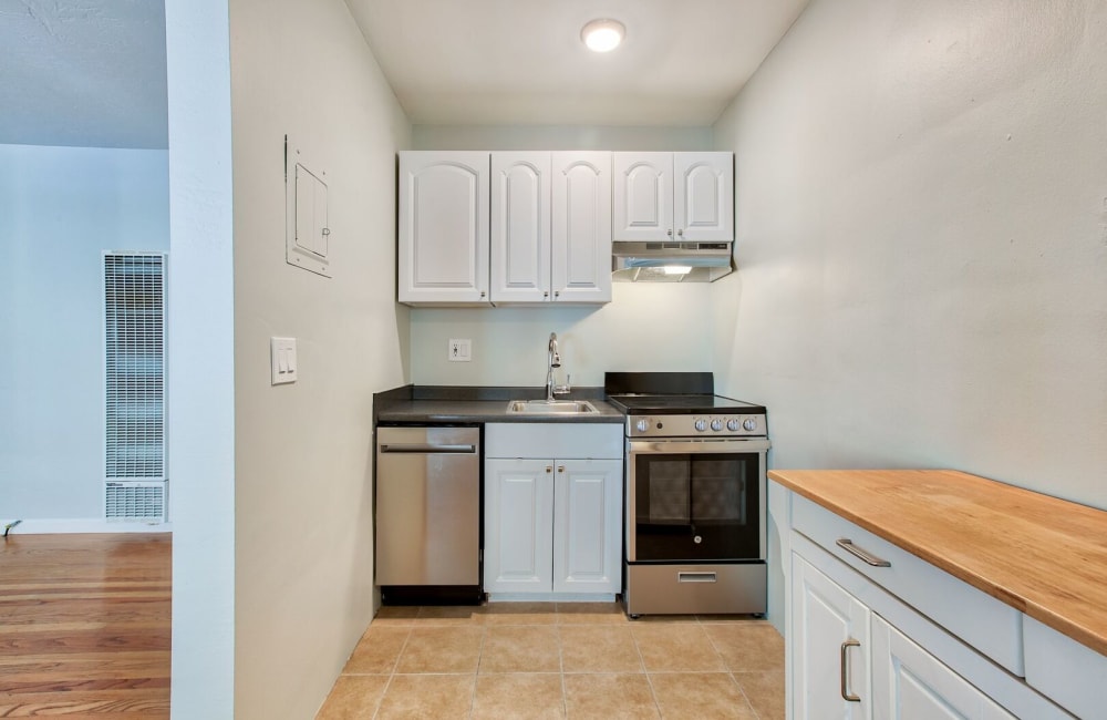 Kitchen with stainless-steel appliances at Hawthorne Apartments in Palo Alto, California