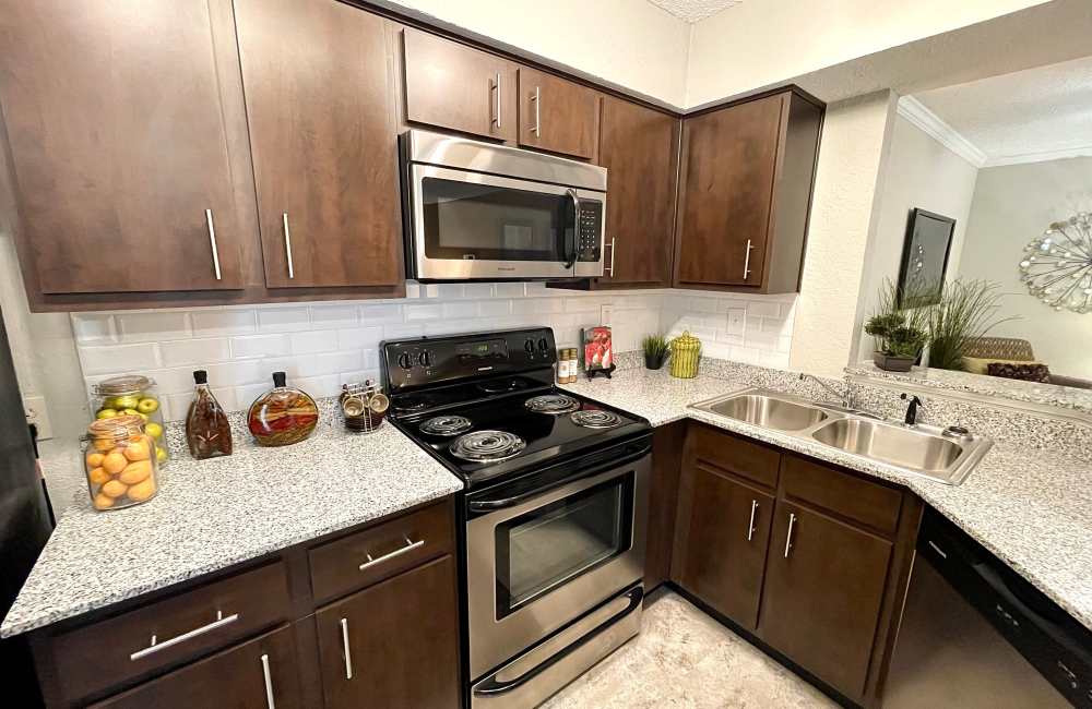 Kitchen with granite countertops at The Abbey at Inverness in Birmingham, Alabama
