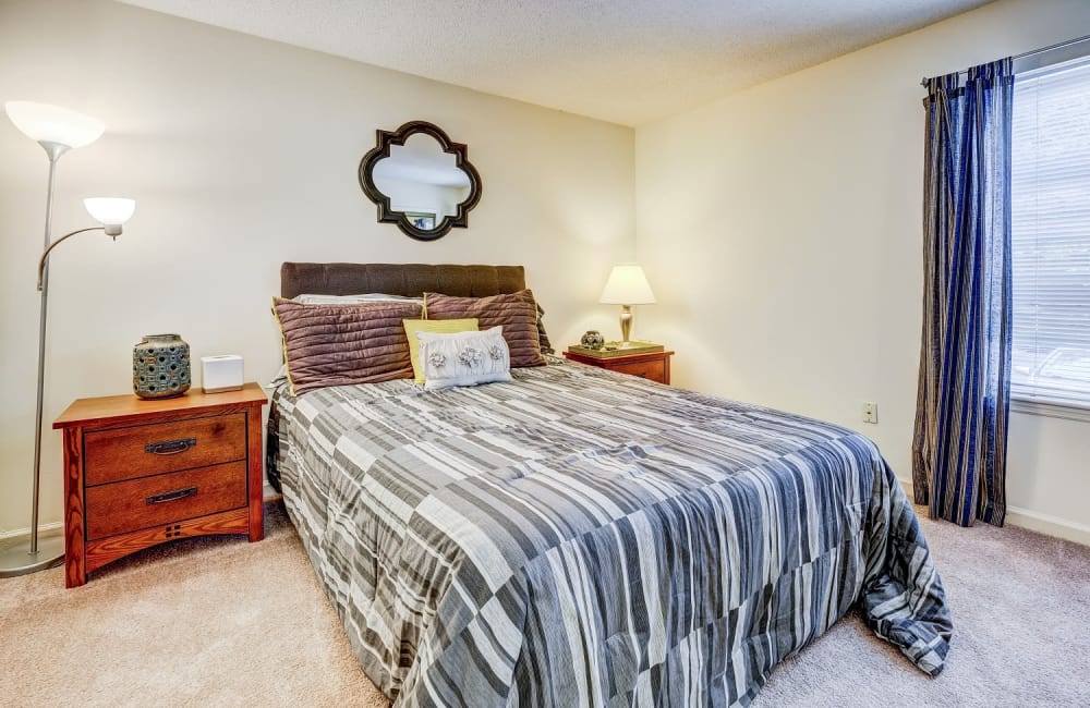 Bedroom with large window at Chason Ridge Apartment Homes in Fayetteville, North Carolina