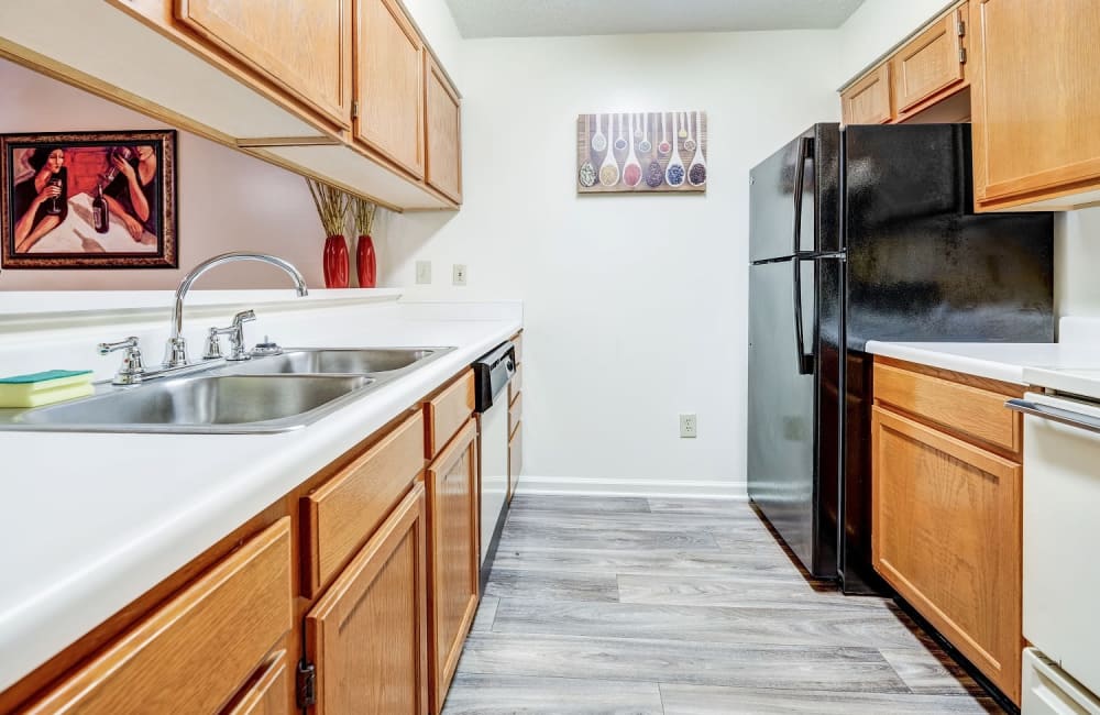 Large bright kitchen with light colored wood cabinets at Chason Ridge Apartment Homes 