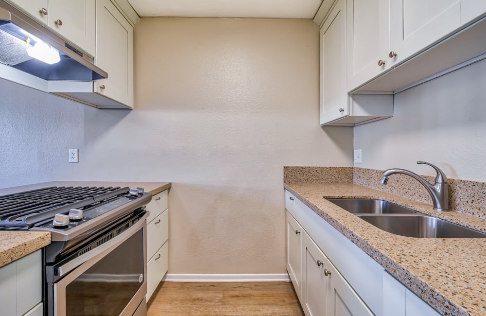 Apartment kitchen at Sycamore Court in Garden Grove, California