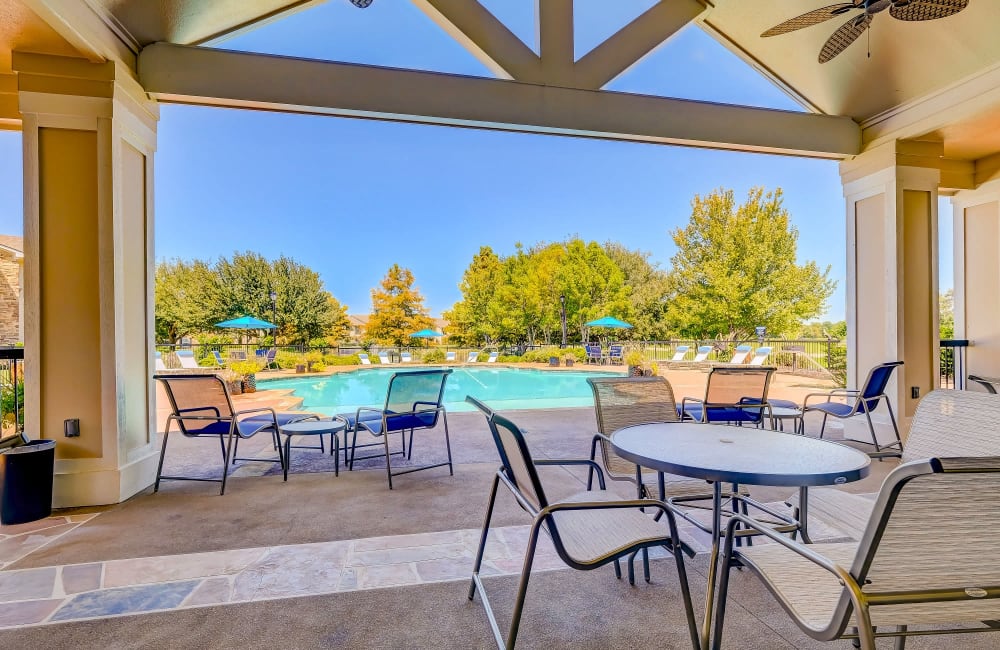 Luxurious swimming pool lounge area at River Walk Apartment Homes in Shreveport, Louisiana