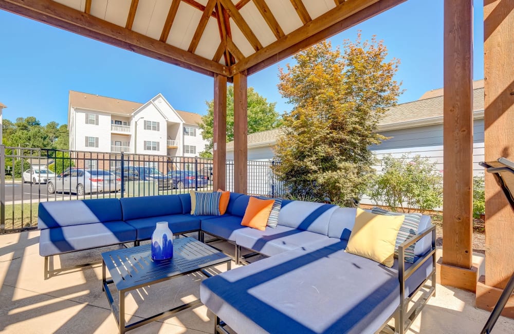 Poolside patio area at Carden Place Apartment Homes in Mebane, North Carolina
