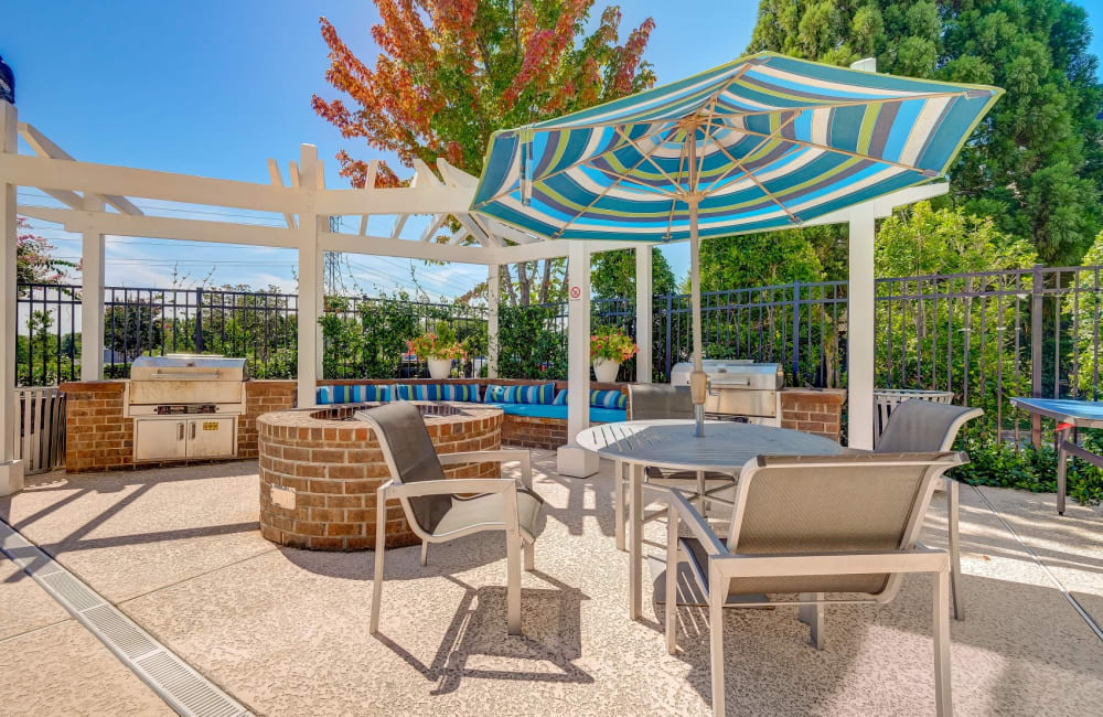 Poolside grilling station at Reserve at Kenton Place Apartment Homes in Cornelius, North Carolina