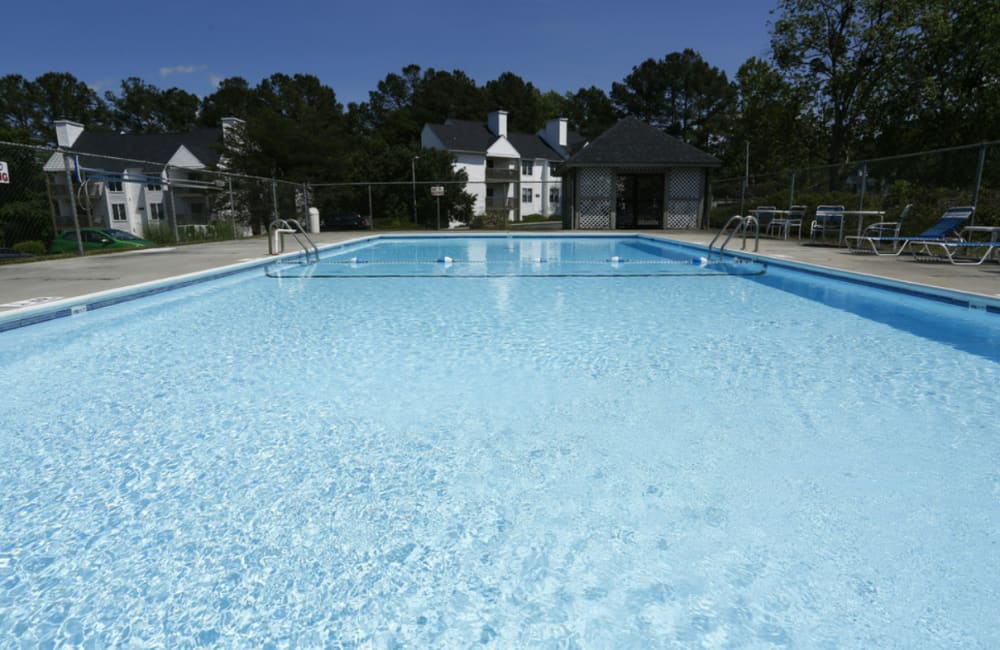 Resident enjoying the pool at The Hampton in Fayetteville, North Carolina