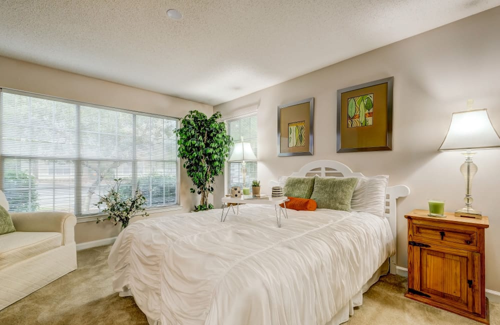 Luxurious and spacious bedroom with access to natural lighting at Keswick Village Apartments & Townhomes in Conyers, Georgia