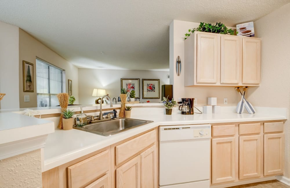 Beautiful modern kitchen with white appliances at Keswick Village Apartments & Townhomes in Conyers, Georgia