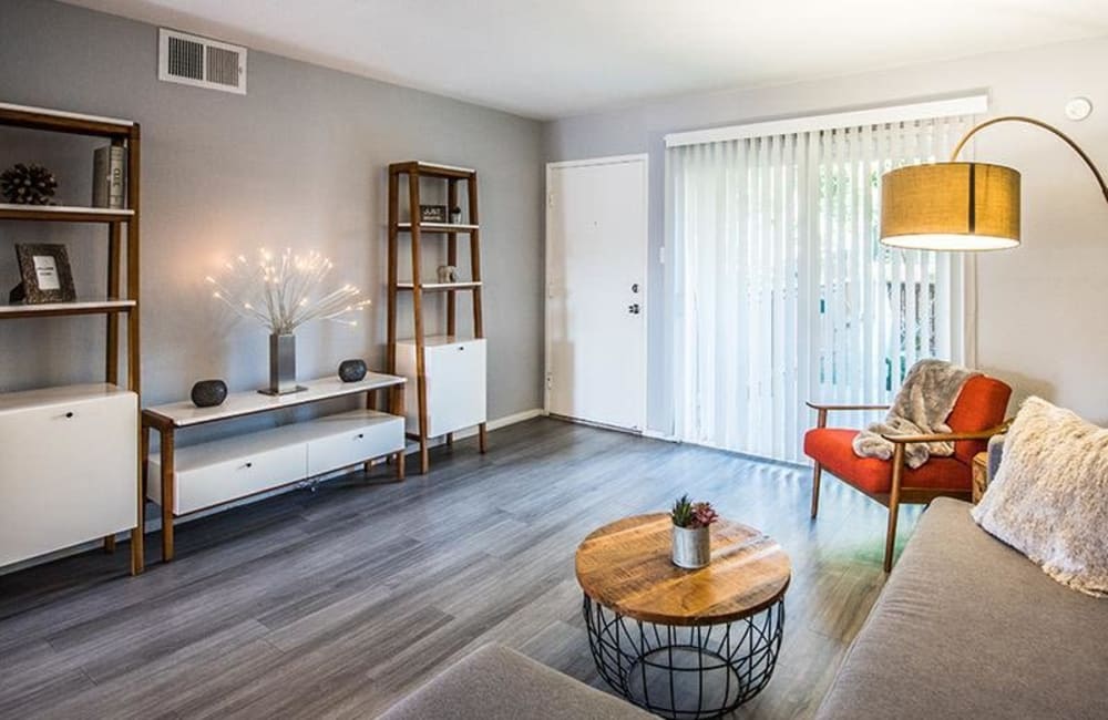 Spacious living room with plank flooring at The Eleven Hundred in Sacramento, California