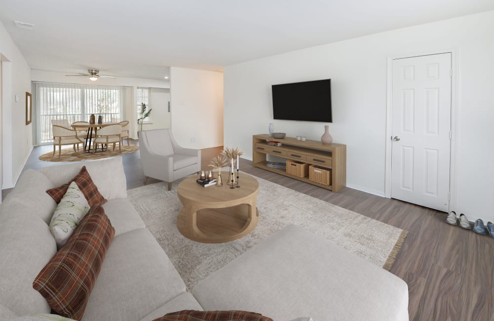 Renovated living room with vinyl plank flooring at Brookside Manor Apartments & Townhomes in Lansdale, Pennsylvania