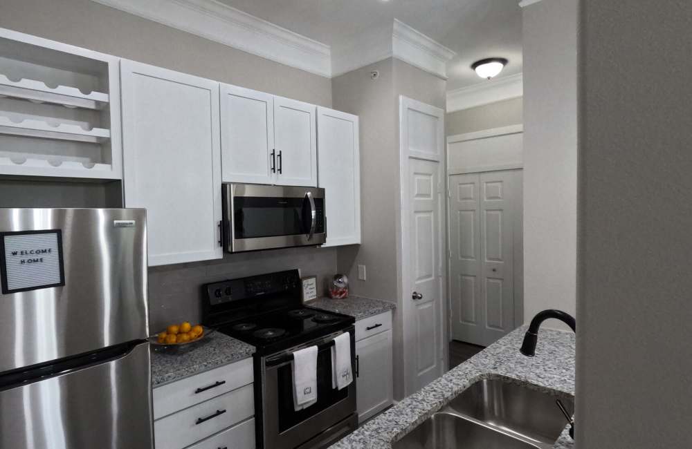 Upgraded kitchen with stainless steel appliances at Heights on Katy in Houston, Texas, 