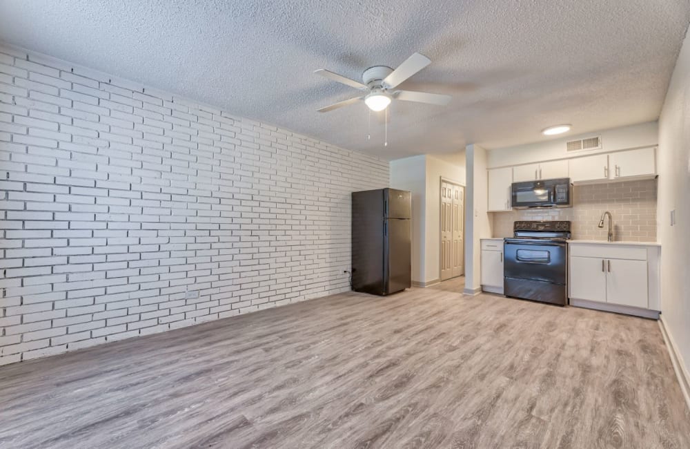 A furnished apartment bedroom at Lovato Apartment Homes in Garland, Texas