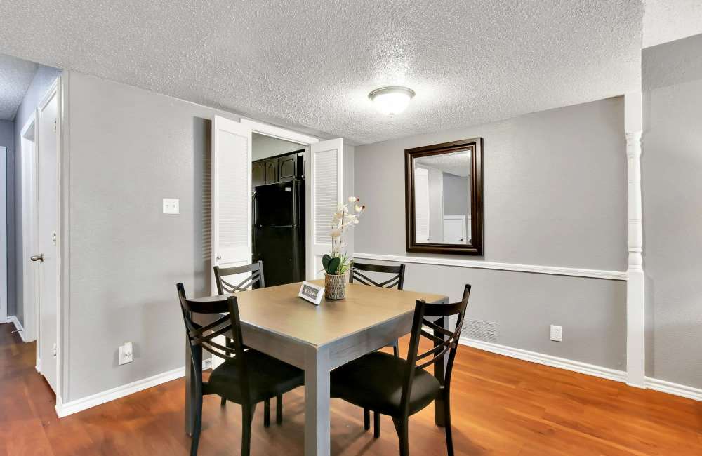 Dining area with upgraded lighting setup at Parkwyn Townhomes in North Richland Hills,Texas