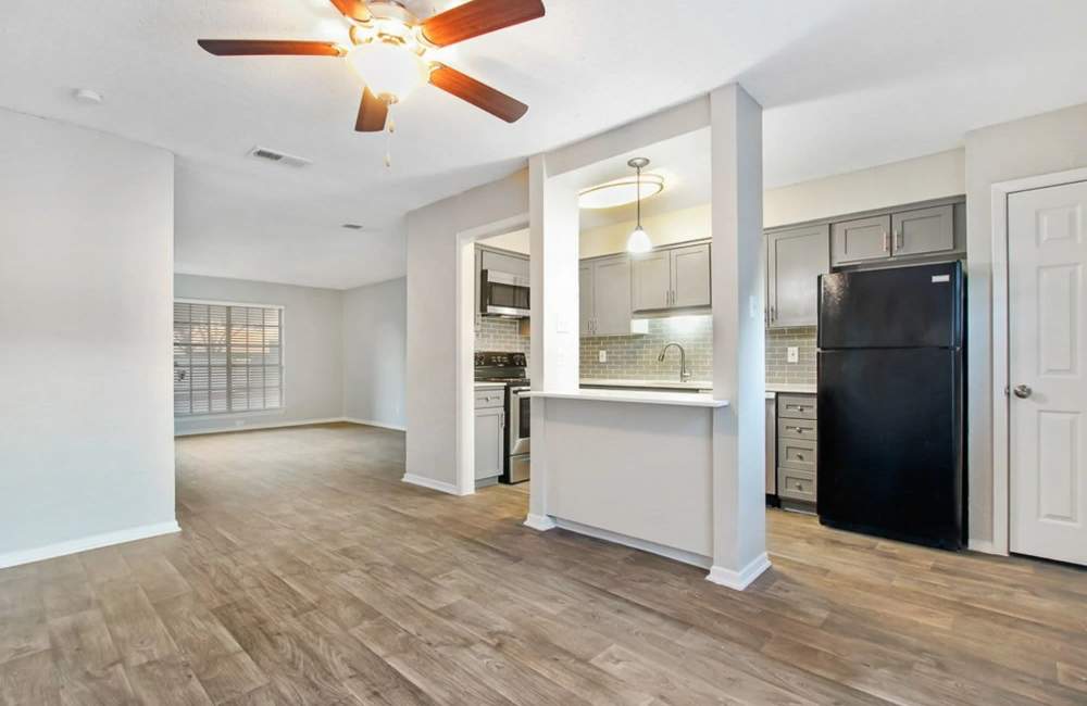 Common area of the apartment with plank-wood flooring throughout at Parkwyn Townhomes in North Richland Hills,Texas